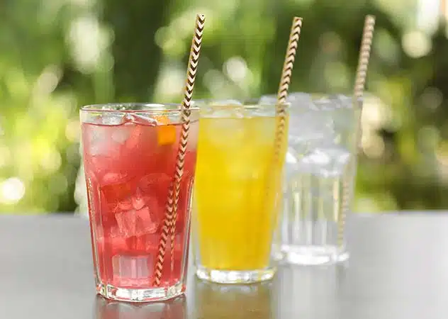 3 flavors of carbonated beverages in glasses