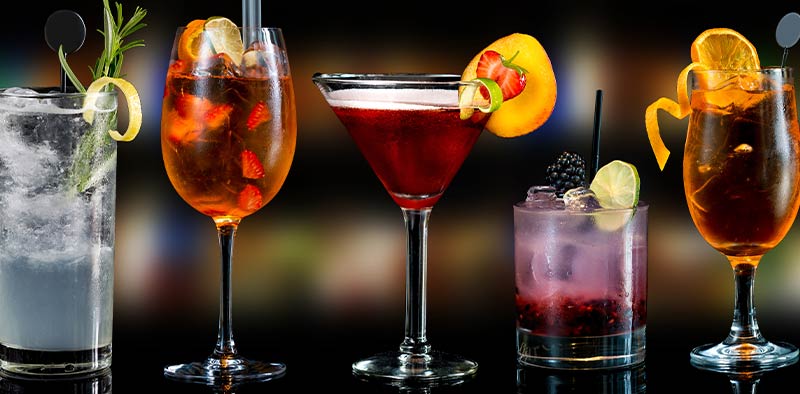 A variety of alcoholic drinks on a bar